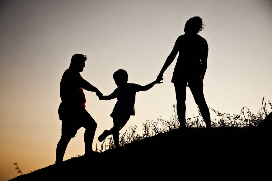 Silhouette of Family Holding Hands